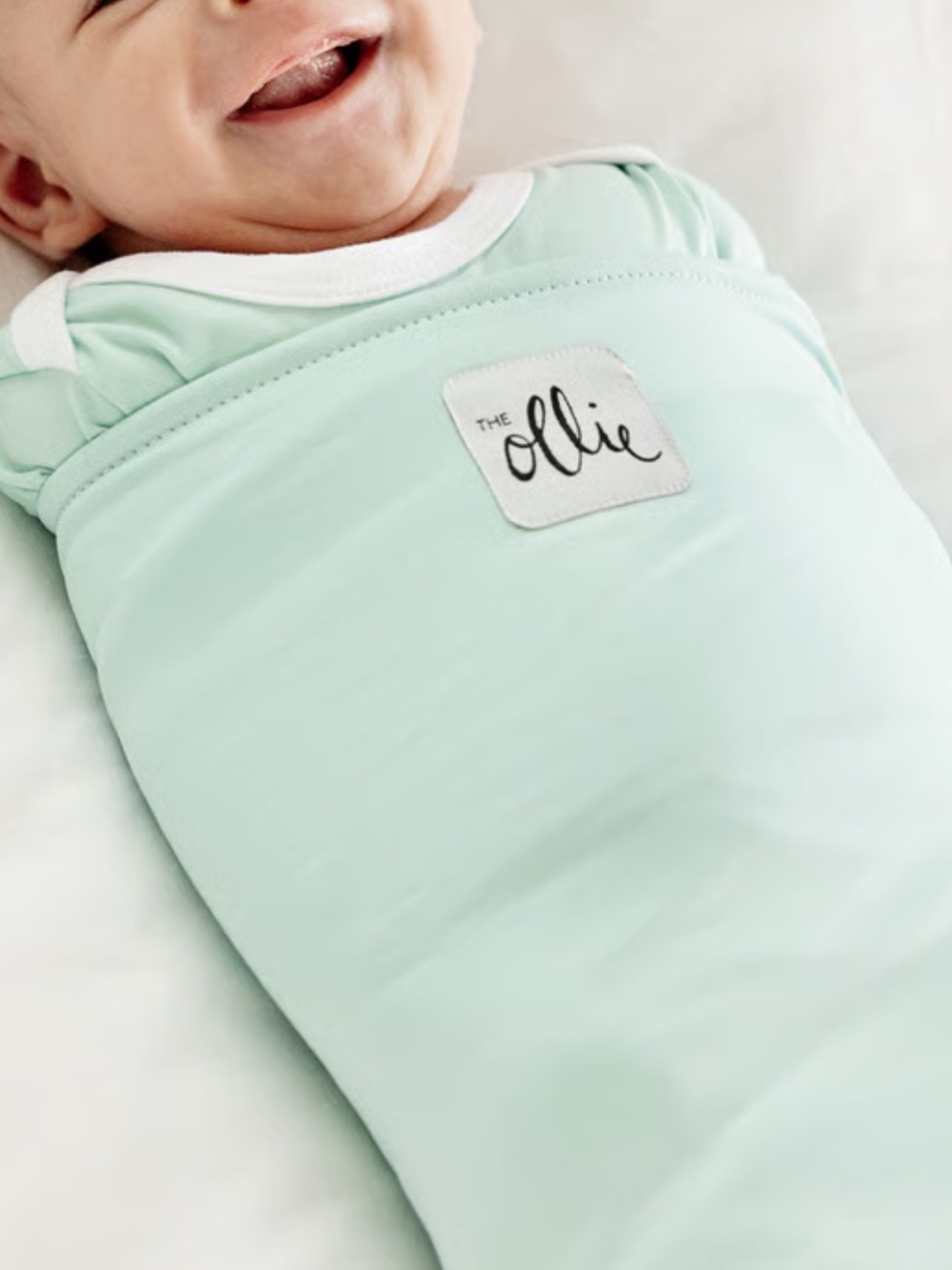 The Ollie® Swaddle helps your little one sleep longer, deeper.